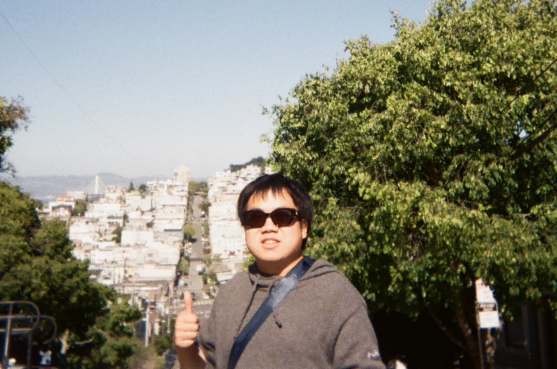 Jinfa Huang outdoors in a city
